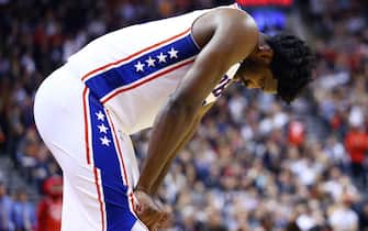 TORONTO, ON - NOVEMBER 25:  Joel Embiid #21 of the Philadelphia 76ers hangs his head during the second half of an NBA game against the Toronto Raptors at Scotiabank Arena on November 25, 2019 in Toronto, Canada.  NOTE TO USER: User expressly acknowledges and agrees that, by downloading and or using this photograph, User is consenting to the terms and conditions of the Getty Images License Agreement.  (Photo by Vaughn Ridley/Getty Images)