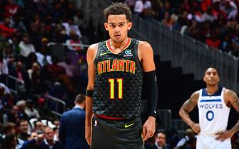ATLANTA, GA - NOVEMBER 25: Trae Young #11 of the Atlanta Hawks looks on during a game against the Minnesota Timberwolves on November 25, 2019 at State Farm Arena in Atlanta, Georgia.  NOTE TO USER: User expressly acknowledges and agrees that, by downloading and/or using this Photograph, user is consenting to the terms and conditions of the Getty Images License Agreement. Mandatory Copyright Notice: Copyright 2019 NBAE (Photo by Scott Cunningham/NBAE via Getty Images)