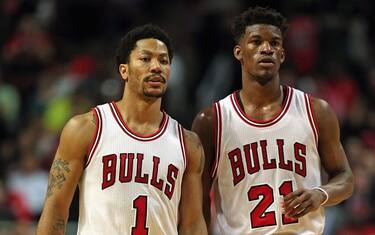 CHICAGO, IL - APRIL 27:  Derrick Rose #1 and Jimmy Butler #21 of the Chicago Bulls wait for a member of the Milwaukee Bucks to shoot a free throw during the first round of the 2015 NBA Playoffs at the United Center on April 27, 2015 in Chicago, Illinois. The Bucks defeated the Bulls 94-88. NOTE TO USER: User expressly acknowledges and agress that, by downloading and or using the photograph, User is consenting to the terms and conditions of the Getty Images License Agreement.  (Photo by Jonathan Daniel/Getty Images)