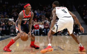 DENVER, COLORADO - NOVEMBER 26: Bradley Beal #3 of the Washington Wizards drives against Will Barton III #5 of the Denver Nuggets in the first quarter at the Pepsi Center on November 26, 2019 in Denver, Colorado. NOTE TO USER: User expressly acknowledges and agrees that, by downloading and or using this photograph, User is consenting to the terms and conditions of the Getty Images License Agreement.  (Photo by Matthew Stockman/Getty Images)