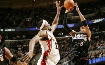 CLEVELAND, OH -  FEBRUARY 4:   Allen Iverson #3 of the Philadelphia 76ers puts up the shot against LeBron James #23 of the Cleveland Cavaliers on February 4, 2006 at The Quicken Loans Arena in Cleveland, Ohio.  NOTE TO USER: User expressly acknowledges and agrees that, by downloading and or using this Photograph, user is consenting to the terms and conditions of the Getty Images License Agreement.   Mandatory Copyright Notice: Copyright 2006 NBAE (Photo By David Sherman/NBAE via Getty Images)