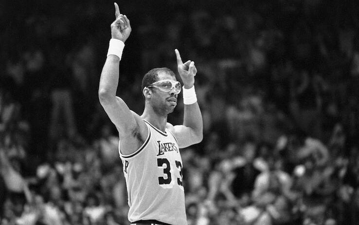 (Original Caption) 6/2/1985-Inglewood, CA- Lakers', Kareem Abdul-Jabbar, acknowledges the cheering crowd during the NBA Championship game against the Celtics, when it was announced that he had become the all-time playoff scoring leader. Ph: Alan Zanger