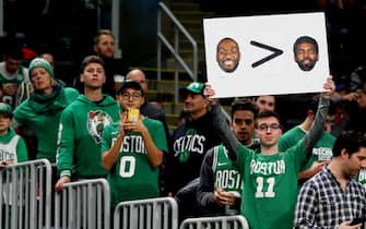 BOSTON, MASSACHUSETTS - NOVEMBER 27: A fan holds a sign with photos of Kyrie Irving and Kemba Walker before the game between the Boston Celtics and the Brooklyn Nets at TD Garden on November 27, 2019 in Boston, Massachusetts. (Photo by Maddie Meyer/Getty Images)