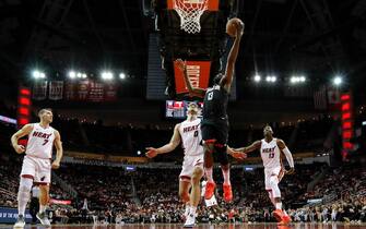 HOUSTON, TX - NOVEMBER 27:  James Harden #13 of the Houston Rockets goes up for a lay up defended by Meyers Leonard #0 of the Miami Heat in the first half at Toyota Center on November 27, 2019 in Houston, Texas.  NOTE TO USER: User expressly acknowledges and agrees that, by downloading and or using this photograph, User is consenting to the terms and conditions of the Getty Images License Agreement.  (Photo by Tim Warner/Getty Images)