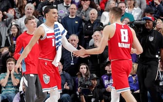 SACRAMENTO, CA - NOVEMBER 30: Justin James #10 and Bogdan Bogdanovic #8 of the Sacramento Kings high five each other during the game on November 30, 2019 at Golden 1 Center in Sacramento, California. NOTE TO USER: User expressly acknowledges and agrees that, by downloading and or using this Photograph, user is consenting to the terms and conditions of the Getty Images License Agreement. Mandatory Copyright Notice: Copyright 2019 NBAE (Photo by Rocky Widner/NBAE via Getty Images)