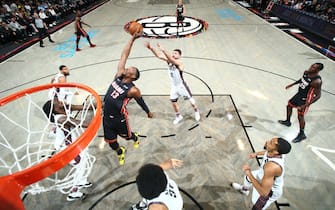 BROOKLYN, NY - DECEMBER 1: Bam Adebayo #13 of the Miami Heat grabs the rebound against the Miami Heat on December 1, 2019 at Barclays Center in Brooklyn, New York. NOTE TO USER: User expressly acknowledges and agrees that, by downloading and or using this Photograph, user is consenting to the terms and conditions of the Getty Images License Agreement. Mandatory Copyright Notice: Copyright 2019 NBAE (Photo by Nathaniel S. Butler/NBAE via Getty Images)