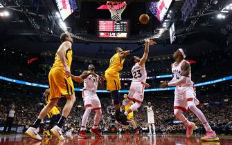 TORONTO, ON - DECEMBER 01:  Fred VanVleet #23 of the Toronto Raptors shoots the ball as Rudy Gobert #27 of the Utah Jazz defends during the second half of an NBA game at Scotiabank Arena on December 01, 2019 in Toronto, Canada.  NOTE TO USER: User expressly acknowledges and agrees that, by downloading and or using this photograph, User is consenting to the terms and conditions of the Getty Images License Agreement.  (Photo by Vaughn Ridley/Getty Images)