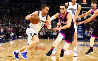 MINNEAPOLIS, MN - JANUARY 11: J.J. Barea #5 of the Dallas Mavericks dribbles while Tyus Jones #1 of the Minnesota Timberwolves defends in the second quarter at Target Center on January 11, 2019 in Minneapolis, Minnesota. The Dallas Mavericks defeated the Minnesota Timberwolves 119-115. NOTE TO USER: User expressly acknowledges and agrees that, by downloading and or using this Photograph, user is consenting to the terms and conditions of the Getty Images License Agreement. (Photo by David Berding/Getty Images)