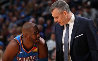 OKLAHOMA CITY, OK- DECEMBER 6: Chris Paul #3 of the Oklahoma City Thunder shares a conversation with Head Coach, Billy Donovan during the game against the Minnesota Timberwolves on December 6, 2019 at Chesapeake Energy Arena in Oklahoma City, Oklahoma. NOTE TO USER: User expressly acknowledges and agrees that, by downloading and or using this photograph, User is consenting to the terms and conditions of the Getty Images License Agreement. Mandatory Copyright Notice: Copyright 2019 NBAE (Photo by Zach Beeker/NBAE via Getty Images)