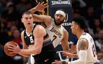 DENVER, COLORADO - DECEMBER 03: Nikola Jokic #15 of the Denver Nuggets looks for an outlet while being guarded by Javale McGee #7 and  Danny Green #14 of the Los Angeles Lakers in the first quarter at Pepsi Center on December 03, 2019 in Denver, Colorado. NOTE TO USER: User expressly acknowledges and agrees that, by downloading and or using this photograph, User is consenting to the terms and conditions of the Getty Images License Agreement. (Photo by Matthew Stockman/Getty Images)