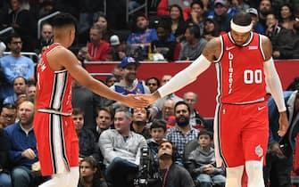 LOS ANGELES, CA - DECEMBER 3: CJ McCollum #3, and Carmelo Anthony #00 of the Portland Trail Blazers hi-five each other against the LA Clippers on December 3, 2019 at STAPLES Center in Los Angeles, California. NOTE TO USER: User expressly acknowledges and agrees that, by downloading and/or using this Photograph, user is consenting to the terms and conditions of the Getty Images License Agreement. Mandatory Copyright Notice: Copyright 2019 NBAE (Photo by Andrew D. Bernstein/NBAE via Getty Images) 