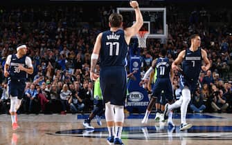 1186526663 DALLAS, TX - DECEMBER 4: Luka Doncic #77 of the Dallas Mavericks reacts to a play against the Minnesota Timberwolves on December 04, 2019 at the American Airlines Center in Dallas, Texas. NOTE TO USER: User expressly acknowledges and agrees that, by downloading and or using this photograph, User is consenting to the terms and conditions of the Getty Images License Agreement. Mandatory Copyright Notice: Copyright 2019 NBAE (Photo by Glenn James/NBAE via Getty Images)