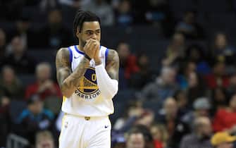 1191989384 CHARLOTTE, NORTH CAROLINA - DECEMBER 04: D'Angelo Russell #0 of the Golden State Warriors watches on against the Charlotte Hornets during their game at Spectrum Center on December 04, 2019 in Charlotte, North Carolina. NOTE TO USER: User expressly acknowledges and agrees that, by downloading and or using this photograph, User is consenting to the terms and conditions of the Getty Images License Agreement. (Photo by Streeter Lecka/Getty Images)