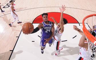 1186528132 PORTLAND, OR - DECEMBER 4: Buddy Hield #24 of the Sacramento Kings shoots the ball during the game against the Portland Trail Blazers on December 4, 2019 at the Moda Center Arena in Portland, Oregon. NOTE TO USER: User expressly acknowledges and agrees that, by downloading and or using this photograph, user is consenting to the terms and conditions of the Getty Images License Agreement. Mandatory Copyright Notice: Copyright 2019 NBAE (Photo by Sam Forencich/NBAE via Getty Images)
