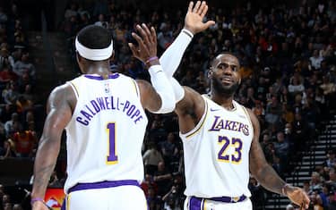 SALT LAKE CITY, UT - DECEMBER 4: Kentavious Caldwell-Pope #1 of the Los Angeles Lakers high fives teammate LeBron James #23 during the game against the Utah Jazz on December 4, 2019 at vivint.SmartHome Arena in Salt Lake City, Utah. NOTE TO USER: User expressly acknowledges and agrees that, by downloading and or using this Photograph, User is consenting to the terms and conditions of the Getty Images License Agreement. Mandatory Copyright Notice: Copyright 2019 NBAE (Photo by Melissa Majchrzak/NBAE via Getty Images)