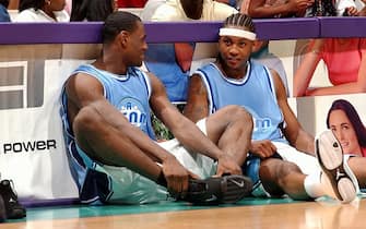 2213802 LOS ANGELES - JULY 27: LeBron James and Carmelo Anthony chat while waiting to check into the game during Magic Johnson's18th annual "A Midsummer Night's Magic" charity game at Staples Center on July 27, 2003 in Los Angeles, California. NOTE TO USER: User expressly acknowledges and agrees that, by downloading and/or using this Photograph, User is consenting to the terms and conditions of the Getty Images License Agreement. (Photo by Andrew D. Bernstein/NBAE via Getty Images)