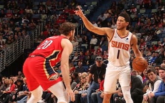 1186691400 NEW ORLEANS, LA - DECEMBER 5: Devin Booker #1 of the Phoenix Suns handles the ball against the New Orleans Pelicans on December 5, 2019 at the Smoothie King Center in New Orleans, Louisiana. NOTE TO USER: User expressly acknowledges and agrees that, by downloading and or using this Photograph, user is consenting to the terms and conditions of the Getty Images License Agreement. Mandatory Copyright Notice: Copyright 2019 NBAE (Photo by Layne Murdoch Jr./NBAE via Getty Images)