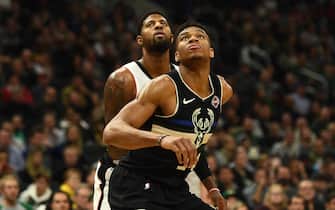 1192403834 MILWAUKEE, WISCONSIN - DECEMBER 06: Giannis Antetokounmpo #34 of the Milwaukee Bucks works against Paul George #13 of the Los Angeles Clippers during the second half of a game at Fiserv Forum on December 06, 2019 in Milwaukee, Wisconsin. NOTE TO USER: User expressly acknowledges and agrees that, by downloading and or using this photograph, User is consenting to the terms and conditions of the Getty Images License Agreement. (Photo by Stacy Revere/Getty Images)