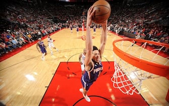 HOUSTON, TX - DECEMBER 7 : Devin Booker #1 of the Phoenix Suns dunks the ball during the game against the Houston Rockets on December 7, 2019 at the Toyota Center in Houston, Texas. NOTE TO USER: User expressly acknowledges and agrees that, by downloading and or using this photograph, User is consenting to the terms and conditions of the Getty Images License Agreement. Mandatory Copyright Notice: Copyright 2019 NBAE (Photo by Bill Baptist/NBAE via Getty Images)
