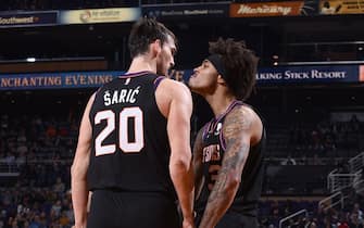 PHOENIX, AZ - DECEMBER 9: Dario Saric #20, and Kelly Oubre Jr. #3 of the Phoenix Suns react to a play against the Minnesota Timberwolves on December 09, 2019 at Talking Stick Resort Arena in Phoenix, Arizona. NOTE TO USER: User expressly acknowledges and agrees that, by downloading and or using this photograph, user is consenting to the terms and conditions of the Getty Images License Agreement. Mandatory Copyright Notice: Copyright 2019 NBAE (Photo by Michael Gonzales/NBAE via Getty Images)