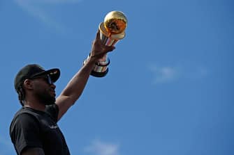 TORONTO, ON - JUNE 17:  Kawhi Leonard #2 of the Toronto Raptors holds the Bill Russell MVP Trophy during the Toronto Raptors Championship Victory Parade on June 17, 2019 in Toronto, Ontario. NOTE TO USER: User expressly acknowledges and agrees that, by downloading and/or using this photograph, user is consenting to the terms and conditions of Getty Images License Agreement. Mandatory Copyright Notice: Copyright 2019 NBAE (Photo by Mark Blinch/NBAE via Getty Images)