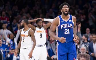 PHILADELPHIA, PA - DECEMBER 10: Joel Embiid #21 of the Philadelphia 76ers reacts in front of Will Barton #5 and Jerami Grant #9 of the Denver Nuggets after making a basket and getting fouled in the third quarter at the Wells Fargo Center on December 10, 2019 in Philadelphia, Pennsylvania. The 76ers defeated the Nuggets 97-92. NOTE TO USER: User expressly acknowledges and agrees that, by downloading and/or using this photograph, user is consenting to the terms and conditions of the Getty Images License Agreement. (Photo by Mitchell Leff/Getty Images)