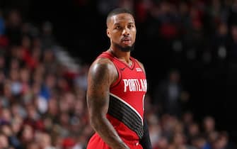PORTLAND, OR - DECEMBER 10: Damian Lillard #0 of the Portland Trail Blazers looks on against the New York Knicks on December 10, 2019 at the Moda Center in Portland, Oregon. NOTE TO USER: User expressly acknowledges and agrees that, by downloading and or using this Photograph, user is consenting to the terms and conditions of the Getty Images License Agreement. Mandatory Copyright Notice: Copyright 2019 NBAE (Photo by Sam Forencich/NBAE via Getty Images)