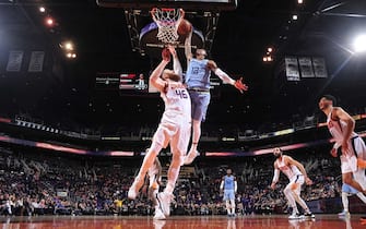 PHOENIX, AZ - DECEMBER 11: Ja Morant #12 of the Memphis Grizzlies shoots the ball against the Phoenix Suns on December 11, 2019 at Talking Stick Resort Arena in Phoenix, Arizona. NOTE TO USER: User expressly acknowledges and agrees that, by downloading and or using this photograph, user is consenting to the terms and conditions of the Getty Images License Agreement. Mandatory Copyright Notice: Copyright 2019 NBAE (Photo by Barry Gossage/NBAE via Getty Images)