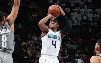 1188069823 BROOKLYN, NY - DECEMBER 11: Devonte' Graham #4 of the Charlotte Hornets shoots a three-pointer against the Brooklyn Nets on December 11, 2019 at Barclays Center in Brooklyn, New York. NOTE TO USER: User expressly acknowledges and agrees that, by downloading and or using this Photograph, user is consenting to the terms and conditions of the Getty Images License Agreement. Mandatory Copyright Notice: Copyright 2019 NBAE (Photo by Nathaniel S. Butler/NBAE via Getty Images)