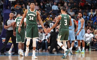 1188351728 MEMPHIS, TN - DECEMBER 13: Giannis Antetokounmpo #34, and George Hill #3 hi-five each other against the Memphis Grizzlies on December 13, 2019 at FedExForum in Memphis, Tennessee. NOTE TO USER: User expressly acknowledges and agrees that, by downloading and or using this photograph, User is consenting to the terms and conditions of the Getty Images License Agreement. Mandatory Copyright Notice: Copyright 2019 NBAE (Photo by Joe Murphy/NBAE via Getty Images)