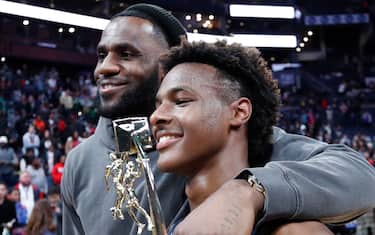 COLUMBUS, OH - DECEMBER 14: LeBron 'Bronny' James Jr. #0 of Sierra Canyon High School with his father LeBron James of the Los Angeles Lakers following the Ohio Scholastic Play-By-Play Classic against St. Vincent-St. Mary High School at Nationwide Arena on December 14, 2019 in Columbus, Ohio. (Photo by Joe Robbins/Getty Images)