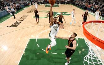 MILWAUKEE, WI - DECEMBER 14: Giannis Antetokounmpo #34 of the Milwaukee Bucks drives to the basket during a game against the Cleveland Cavaliers on December 14, 2019 at the Fiserv Forum Center in Milwaukee, Wisconsin. NOTE TO USER: User expressly acknowledges and agrees that, by downloading and or using this Photograph, user is consenting to the terms and conditions of the Getty Images License Agreement. Mandatory Copyright Notice: Copyright 2019 NBAE (Photo by Gary Dineen/NBAE via Getty Images).