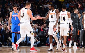 DENVER, CO - DECEMBER 14: Nikola Jokic #15 and Jerami Grant #9 of the Denver Nuggets hi-five during a game against the Oklahoma City Thunder on December 14, 2019 at the Pepsi Center in Denver, Colorado. NOTE TO USER: User expressly acknowledges and agrees that, by downloading and/or using this Photograph, user is consenting to the terms and conditions of the Getty Images License Agreement. Mandatory Copyright Notice: Copyright 2019 NBAE (Photo by Bart Young/NBAE via Getty Images)