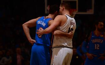 DENVER, CO - DECEMBER 14: Danilo Gallinari #8 of the Oklahoma City Thunder and Nikola Jokic #15 of the Denver Nuggets hug during a game on December 14, 2019 at the Pepsi Center in Denver, Colorado. NOTE TO USER: User expressly acknowledges and agrees that, by downloading and/or using this Photograph, user is consenting to the terms and conditions of the Getty Images License Agreement. Mandatory Copyright Notice: Copyright 2019 NBAE (Photo by Bart Young/NBAE via Getty Images)