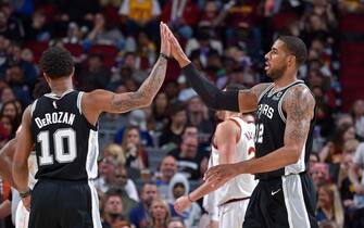 CLEVELAND, OH - APRIL 7:  DeMar DeRozan #10 and LaMarcus Aldridge #12 of the San Antonio Spurs high five against the Cleveland Cavaliers on April 7, 2019 at Quicken Loans Arena in Cleveland, Ohio. NOTE TO USER: User expressly acknowledges and agrees that, by downloading and/or using this Photograph, user is consenting to the terms and conditions of the Getty Images License Agreement. Mandatory Copyright Notice: Copyright 2019 NBAE (Photo by David Liam Kyle/NBAE via Getty Images)
