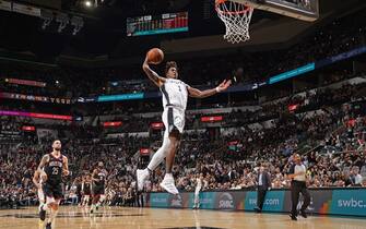 SAN ANTONIO, TX - DECEMBER 3: Lonnie Walker IV #1 of the San Antonio Spurs dunks the ball against the Houston Rockets on December 3, 2019 at the AT&T Center in San Antonio, Texas. NOTE TO USER: User expressly acknowledges and agrees that, by downloading and or using this photograph, user is consenting to the terms and conditions of the Getty Images License Agreement. Mandatory Copyright Notice: Copyright 2019 NBAE (Photos by Darren Carroll/NBAE via Getty Images)