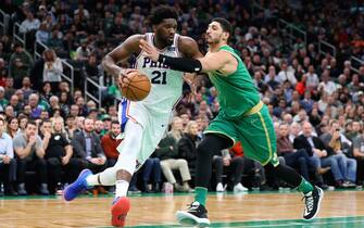 BOSTON, MASSACHUSETTS - DECEMBER 12: Enes Kanter #11 of the Boston Celtics fouls Joel Embiid #21 of the Philadelphia 76ers at TD Garden on December 12, 2019 in Boston, Massachusetts.  The 76ers defeat the Celtics 115-109. NOTE TO USER: User expressly acknowledges and agrees that, by downloading and or using this photograph, User is consenting to the terms and conditions of the Getty Images License Agreement.  (Photo by Maddie Meyer/Getty Images)