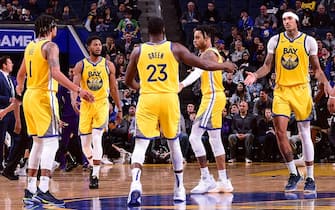 SAN FRANCISCO, CA - DECEMBER 15: Golden State Warriors high-fives each other during the game against the Sacramento Kings on December 15, 2019 at Chase Center in San Francisco, California. NOTE TO USER: User expressly acknowledges and agrees that, by downloading and or using this photograph, user is consenting to the terms and conditions of Getty Images License Agreement. Mandatory Copyright Notice: Copyright 2019 NBAE (Photo by Noah Graham/NBAE via Getty Images)