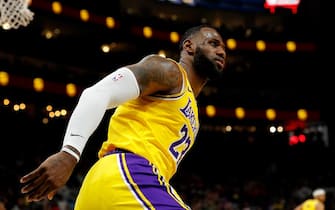 ATLANTA, GEORGIA - DECEMBER 15:  LeBron James #23 of the Los Angeles Lakers reacts after dunking against the Atlanta Hawks in the first half at State Farm Arena on December 15, 2019 in Atlanta, Georgia.  NOTE TO USER: User expressly acknowledges and agrees that, by downloading and/or using this photograph, user is consenting to the terms and conditions of the Getty Images License Agreement.  (Photo by Kevin C. Cox/Getty Images)