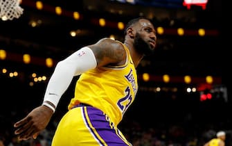 1194196190 ATLANTA, GEORGIA - DECEMBER 15: LeBron James #23 of the Los Angeles Lakers reacts after dunking against the Atlanta Hawks in the first half at State Farm Arena on December 15, 2019 in Atlanta, Georgia. NOTE TO USER: User expressly acknowledges and agrees that, by downloading and/or using this photograph, user is consenting to the terms and conditions of the Getty Images License Agreement. (Photo by Kevin C. Cox/Getty Images)