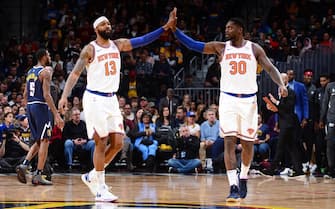 1188987036 DENVER, CO - DECEMBER 15: Marcus Morris Sr. #13 of the New York Knicks and Julius Randle #30 of the New York Knicks high-five during a game against the Denver Nuggets on December 15, 2019 at the Pepsi Center in Denver, Colorado. NOTE TO USER: User expressly acknowledges and agrees that, by downloading and/or using this Photograph, user is consenting to the terms and conditions of the Getty Images License Agreement. Mandatory Copyright Notice: Copyright 2019 NBAE (Photo by Bart Young/NBAE via Getty Images)