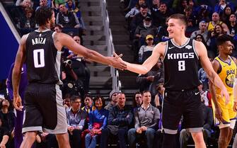 SAN FRANCISCO, CA - DECEMBER 15: Trevor Ariza #0 of the Sacramento Kings high-fives Bogdan Bogdanovic #8 of the Sacramento Kings against the Golden State Warriors on December 15, 2019 at Chase Center in San Francisco, California. NOTE TO USER: User expressly acknowledges and agrees that, by downloading and or using this photograph, user is consenting to the terms and conditions of Getty Images License Agreement. Mandatory Copyright Notice: Copyright 2019 NBAE (Photo by Noah Graham/NBAE via Getty Images)