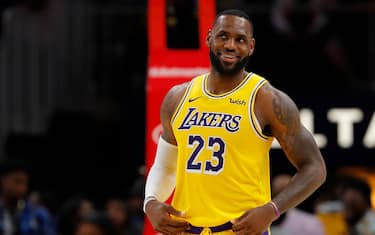 ATLANTA, GEORGIA - DECEMBER 15:  LeBron James #23 of the Los Angeles Lakers enjoys a laugh during the first half against the Atlanta Hawks at State Farm Arena on December 15, 2019 in Atlanta, Georgia.  NOTE TO USER: User expressly acknowledges and agrees that, by downloading and/or using this photograph, user is consenting to the terms and conditions of the Getty Images License Agreement.  (Photo by Kevin C. Cox/Getty Images)