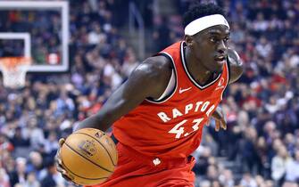 TORONTO, ON - DECEMBER 16:  Pascal Siakam #43 of the Toronto Raptors dribbles the ball during the first half of an NBA game against the Cleveland Cavaliers at Scotiabank Arena on December 16, 2019 in Toronto, Canada.  NOTE TO USER: User expressly acknowledges and agrees that, by downloading and or using this photograph, User is consenting to the terms and conditions of the Getty Images License Agreement.  (Photo by Vaughn Ridley/Getty Images)