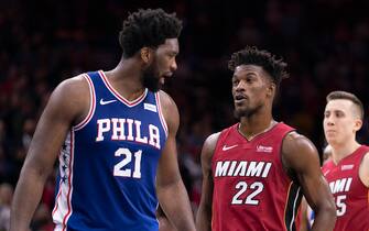PHILADELPHIA, PA - DECEMBER 18: Joel Embiid #21 of the Philadelphia 76ers talks to Jimmy Butler #22 of the Miami Heat in the fourth quarter at the Wells Fargo Center on December 18, 2019 in Philadelphia, Pennsylvania. The Heat defeated the 76ers 108-104. NOTE TO USER: User expressly acknowledges and agrees that, by downloading and/or using this photograph, user is consenting to the terms and conditions of the Getty Images License Agreement. (Photo by Mitchell Leff/Getty Images)