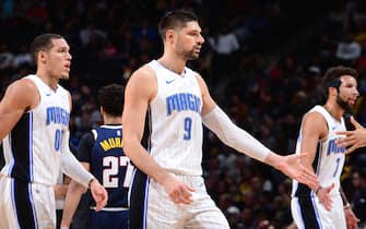 DENVER, CO - DECEMBER 18: Nikola Vucevic #9 of the Orlando Magic high-fives teammates during the game against the Denver Nuggets on December 18, 2019 at the Pepsi Center in Denver, Colorado. NOTE TO USER: User expressly acknowledges and agrees that, by downloading and/or using this Photograph, user is consenting to the terms and conditions of the Getty Images License Agreement. Mandatory Copyright Notice: Copyright 2019 NBAE (Photo by Bart Young/NBAE via Getty Images)