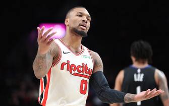 PORTLAND, OREGON - DECEMBER 18: Damian Lillard #0 of the Portland Trail Blazers reacts in the first quarter against the Golden State Warriors during their game at Moda Center on December 18, 2019 in Portland, Oregon. NOTE TO USER: User expressly acknowledges and agrees that, by downloading and or using this photograph, User is consenting to the terms and conditions of the Getty Images License Agreement (Photo by Abbie Parr/Getty Images)