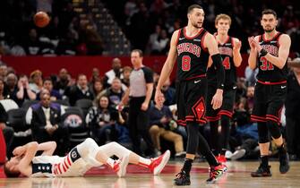 WASHINGTON, DC - DECEMBER 18: Zach LaVine #8 of the Chicago Bulls reacts after being fouled by Davis Bertans #42 of the Washington Wizards on a three point attempt in the second half at Capital One Arena on December 18, 2019 in Washington, DC. NOTE TO USER: User expressly acknowledges and agrees that, by downloading and or using this photograph, User is consenting to the terms and conditions of the Getty Images License Agreement. (Photo by Patrick McDermott/Getty Images)
