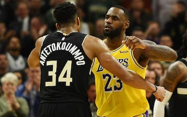 MILWAUKEE, WISCONSIN - DECEMBER 19:  Giannis Antetokounmpo #34 of the Milwaukee Bucks and LeBron James #23 of the Los Angeles Lakers hug following a game at Fiserv Forum on December 19, 2019 in Milwaukee, Wisconsin. NOTE TO USER: User expressly acknowledges and agrees that, by downloading and or using this photograph, User is consenting to the terms and conditions of the Getty Images License Agreement. (Photo by Stacy Revere/Getty Images)