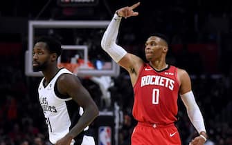 LOS ANGELES, CALIFORNIA - DECEMBER 19:  Russell Westbrook #0 of the Houston Rockets celebrates his three pointer behind Patrick Beverley #21 of the LA Clippers to take a 101-89 lead, during the fourth quarter in a 122-117 Rockets win at Staples Center on December 19, 2019 in Los Angeles, California.  NOTE TO USER: User expressly acknowledges and agrees that, by downloading and or using this photograph, User is consenting to the terms and conditions of the Getty Images License Agreement. (Photo by Harry How/Getty Images)